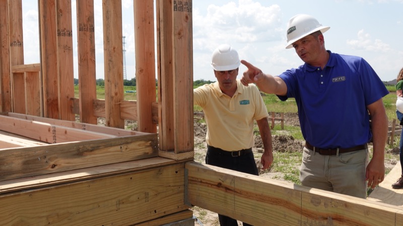 Team inspects a building under construction