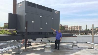 Man pointing to onsite power generation system