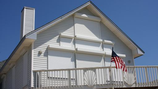 Storm shutters cover a homes windows and doors in Texas