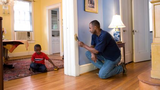 Man removes lead paint